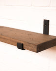 Dark oak colour radiator shelf with metal hanging brackets made from scaffolding boards