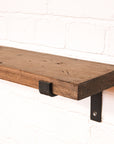 Propped bracket radiator shelf with a dark wooden finish