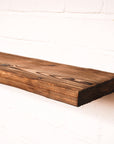 Charred effect floating wooden radiator shelf at 165mm wide