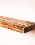 Floating wooden flamed effect shelf with dramatic looking rain pattern