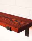 Shou Sugi Ban Effect shelving with red dye for dramatic effect.