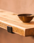 Rustic scaffold shelf with brass display