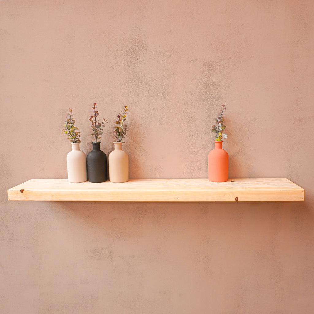 Unsanded reclaimed scaffold board as a shelf with plant pots