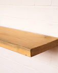 New scaffold board with antique danish oil hanging on wall