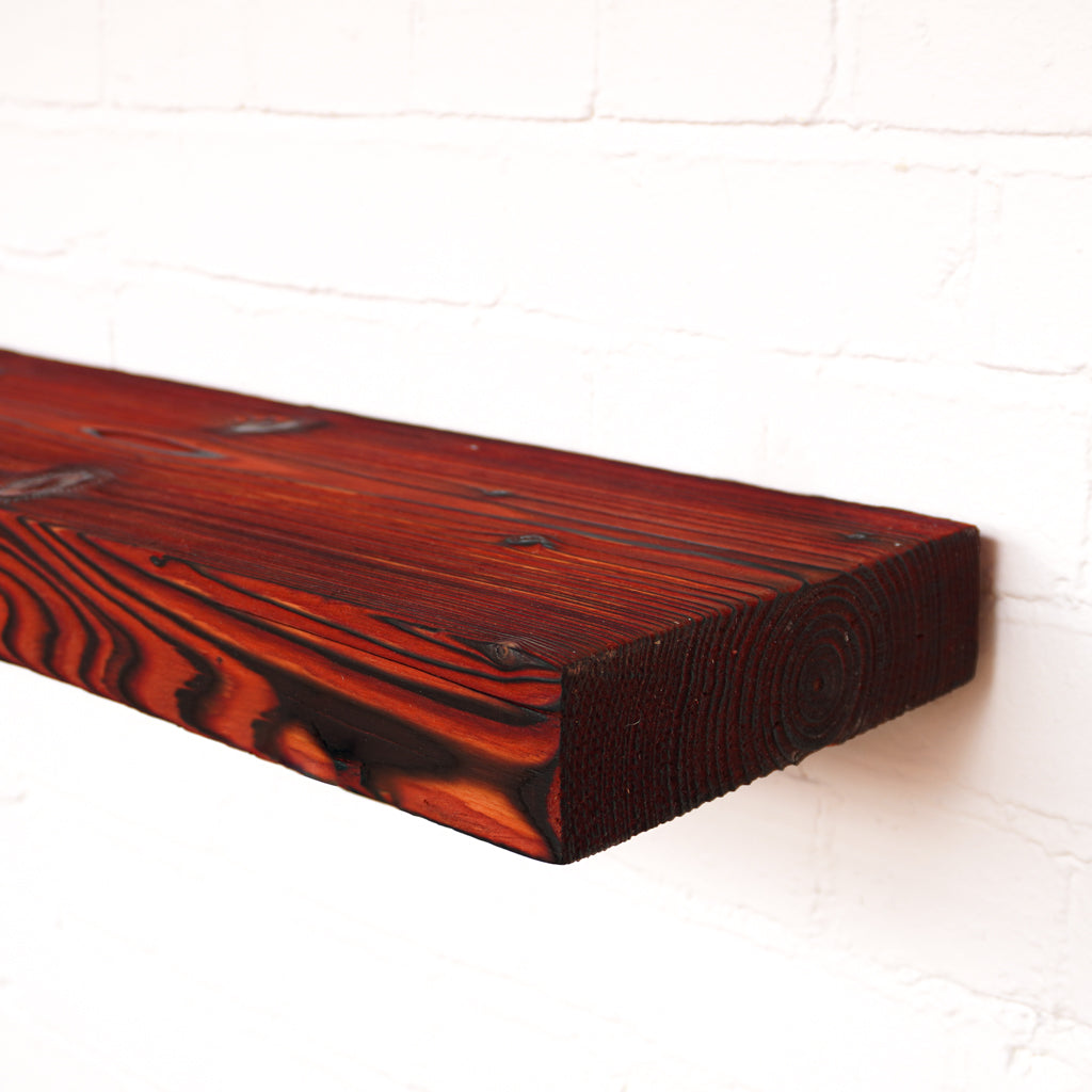 Charred and red coloured chunky reclaimed scaffold board