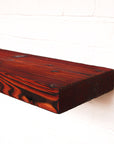 Charred and red coloured chunky reclaimed scaffold board