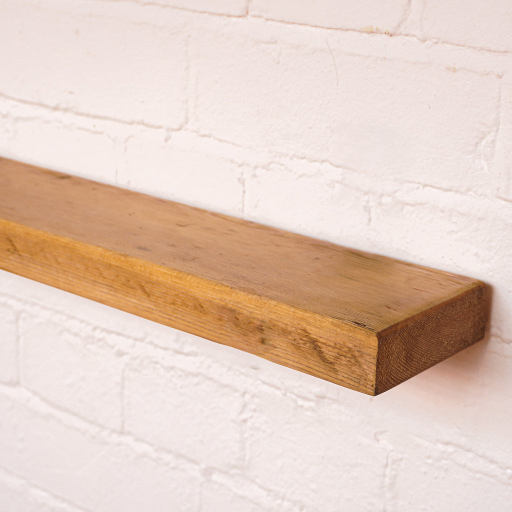 Sanded reclaimed timber board with floating bracket and antique oil