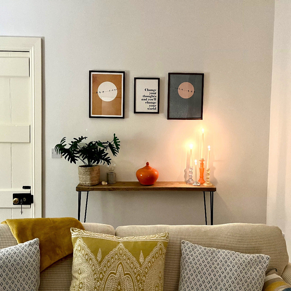The Scaff Shop Console Table in room with artwork and low lighting
