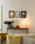 The Scaff Shop Console Table in room with artwork and low lighting