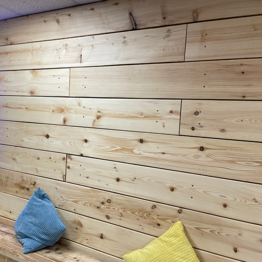 Kiln dried scaffold boards made in to wall cladding in arts centre