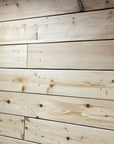 Scaffold boards made in to effective cladding on a wall