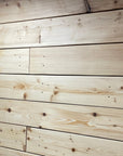 Arts centre wall cladded with new kiln dried scaffold timber