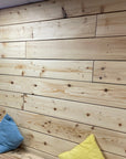 Kiln dried scaffold boards made in to wall cladding in arts centre