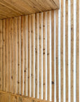 Scaffold board battens oiled and sanded, cladded on to wall