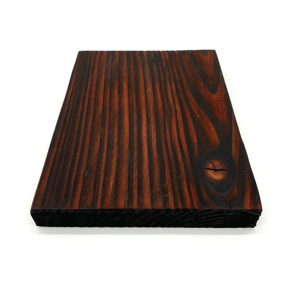 Scorched and dyed red scaffold board