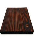 Scorched and dyed red scaffold board