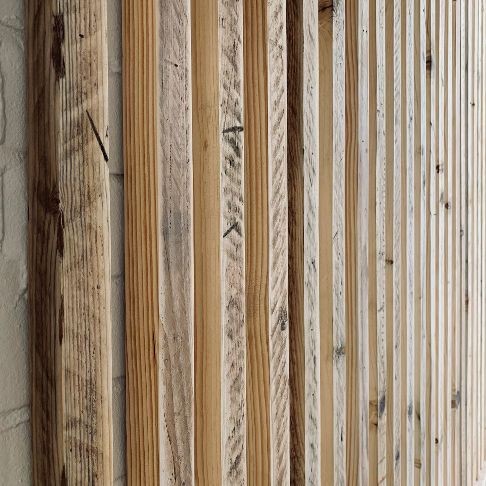Hit and miss cladding made from reclaimed timber scaffold boards