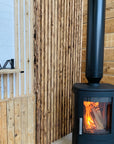 Scaffold board cladding next to pallet wood cladding