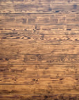 Scorched wall made from blow torched and scraped scaffold boards