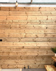 Scaffold boards in The Scaff Shop showroom, made in to a whole wall