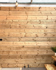 Scaffold board cladding on showroom wall