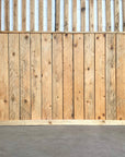 Pallet wood used on lower hlad of wall only as vertical cladding