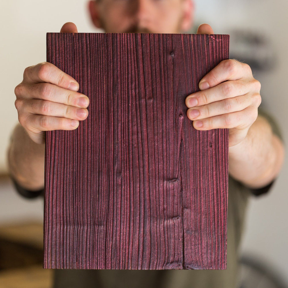 Sample of red coloured and oiled reclaimed scaffold board at The Scaff Shop
