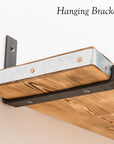 Reclaimed scaffold board shelf hanging off of a steel bracket