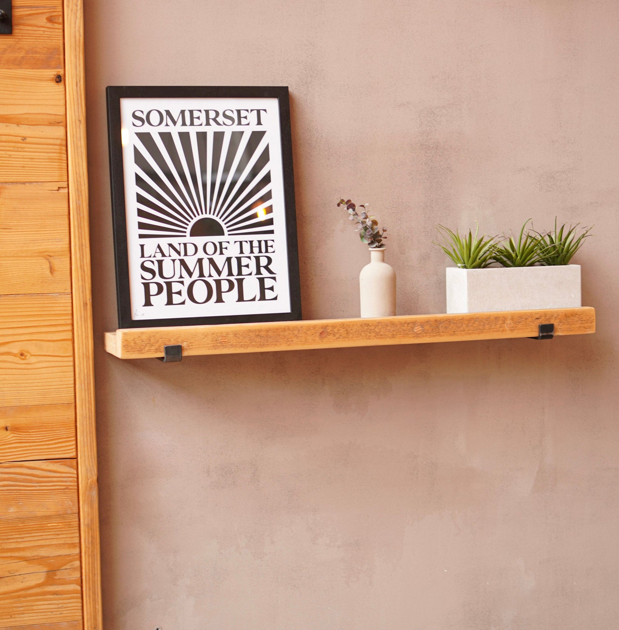 Wooden picture shelf made from scaffolding boards