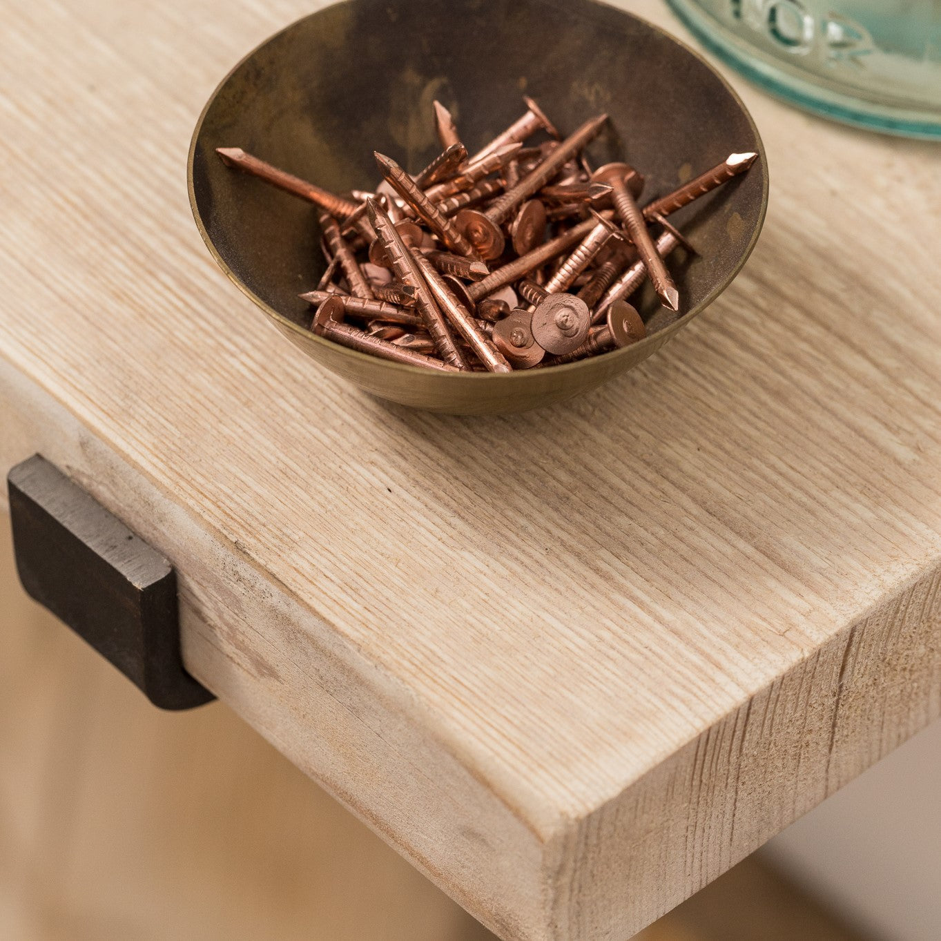 New wooden shelf with brackets and copper nails