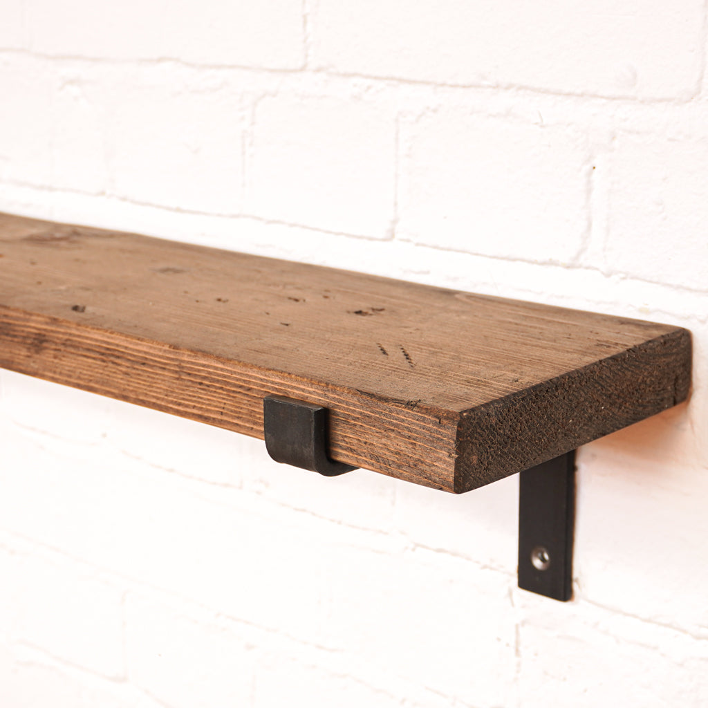Propped bracket radiator shelf with a dark wooden finish