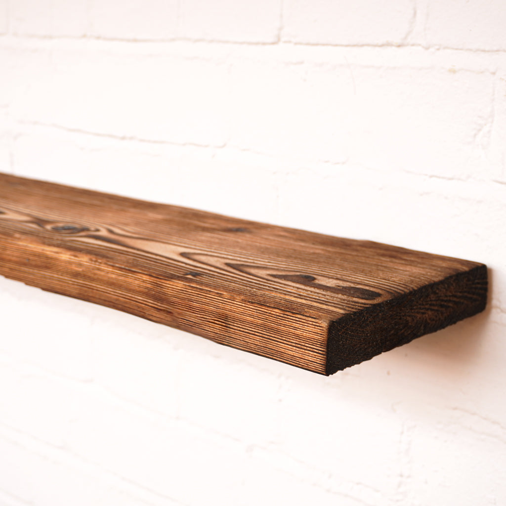 Charred effect floating wooden radiator shelf at 165mm wide