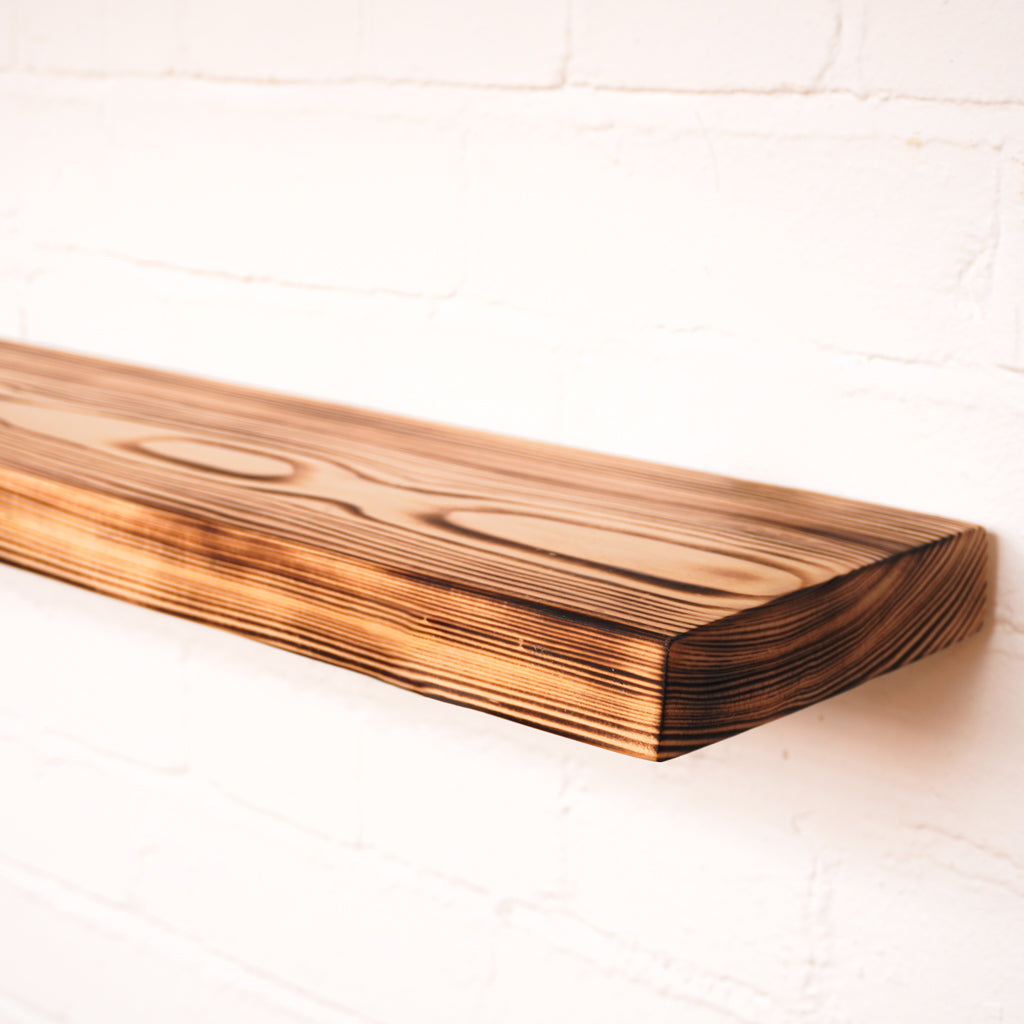 Floating wooden flamed effect shelf with dramatic looking rain pattern