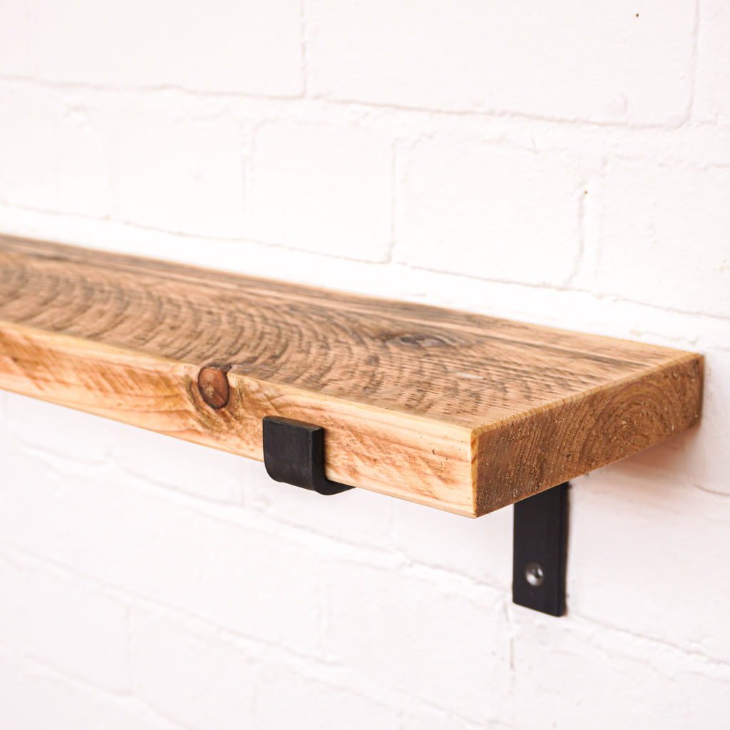 Natural looking timber radiator shelf with propped metal brackets