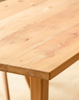 Close-up of a wooden table with a light wood finish using Antique danish oil