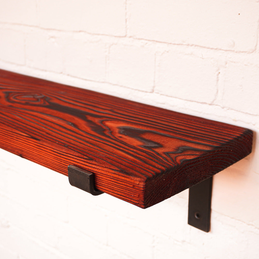 Shou Sugi Ban Effect shelving with red dye for dramatic effect.