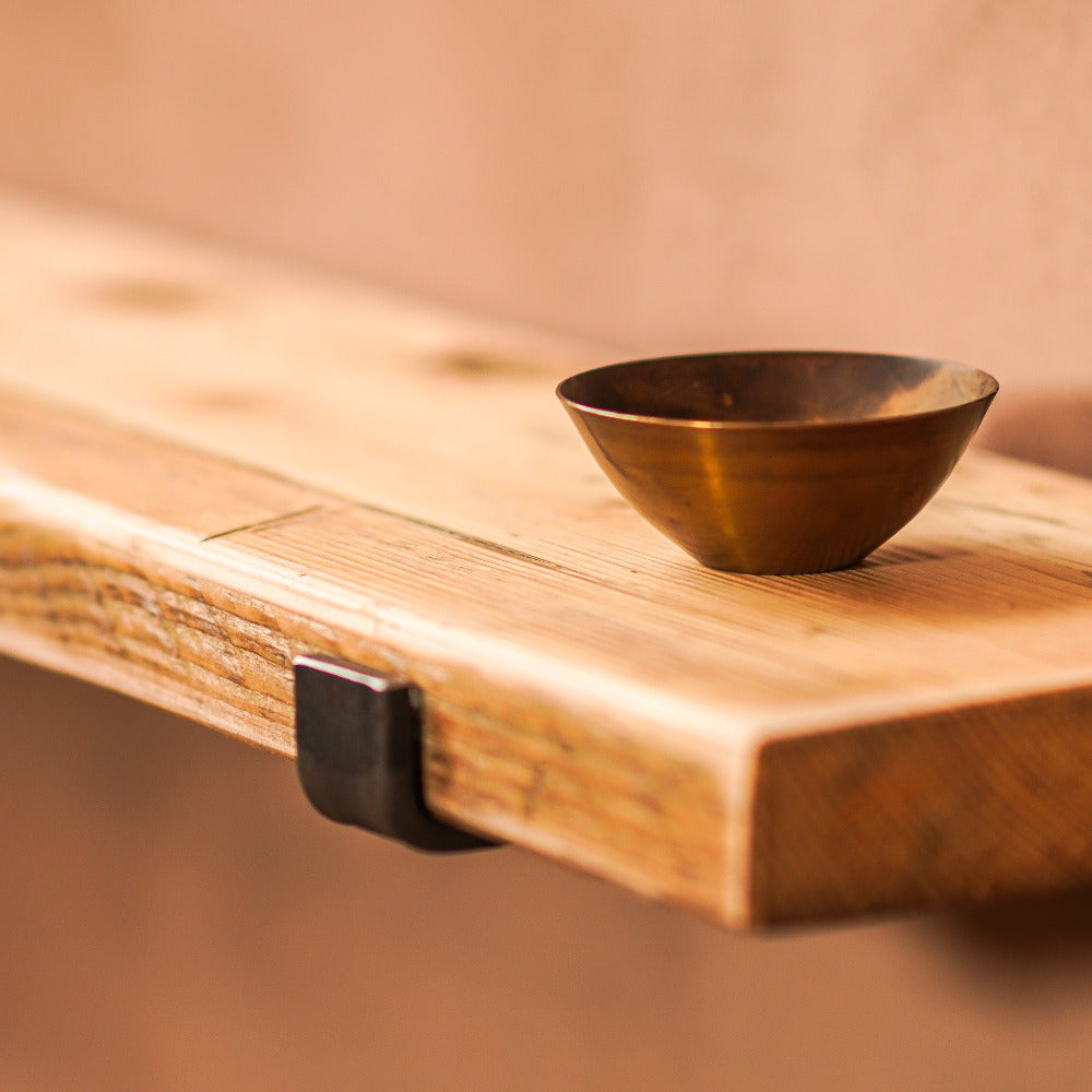 Rustic scaffold shelf with brass display