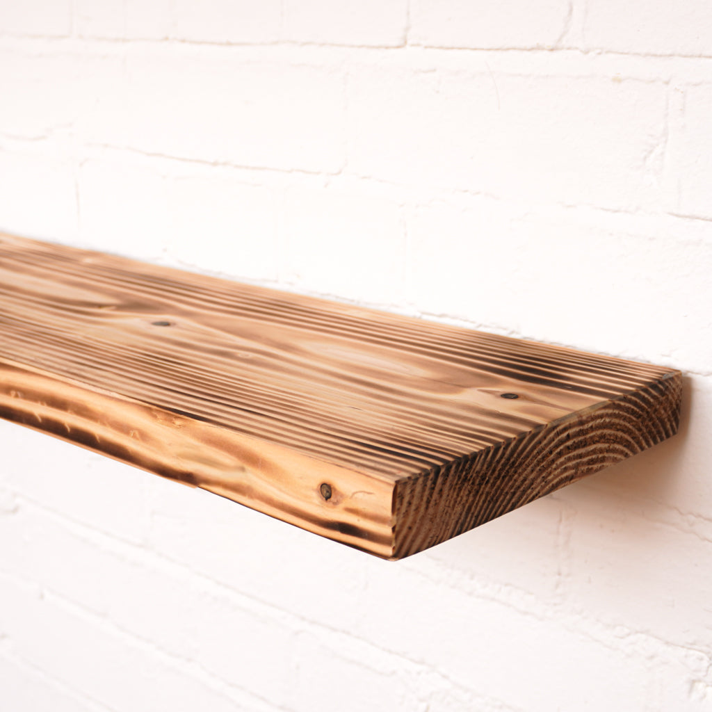 Reclaimed scaffold board in lightly flamed finish with floating brackets