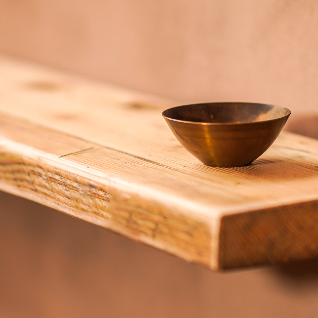 Reclaimed scaffolding board made into a floating shelf with a natural finish