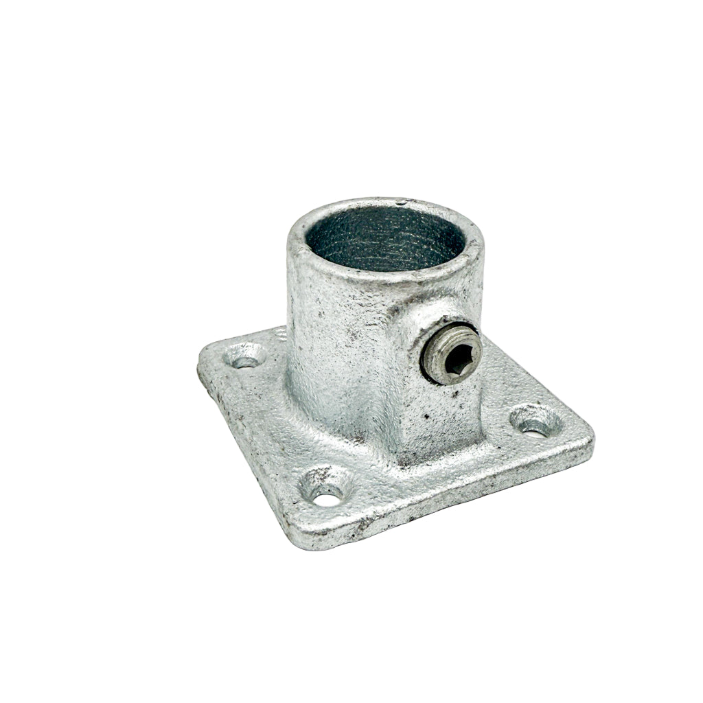 Metal fitting with cylindrical hole and square base on a white background