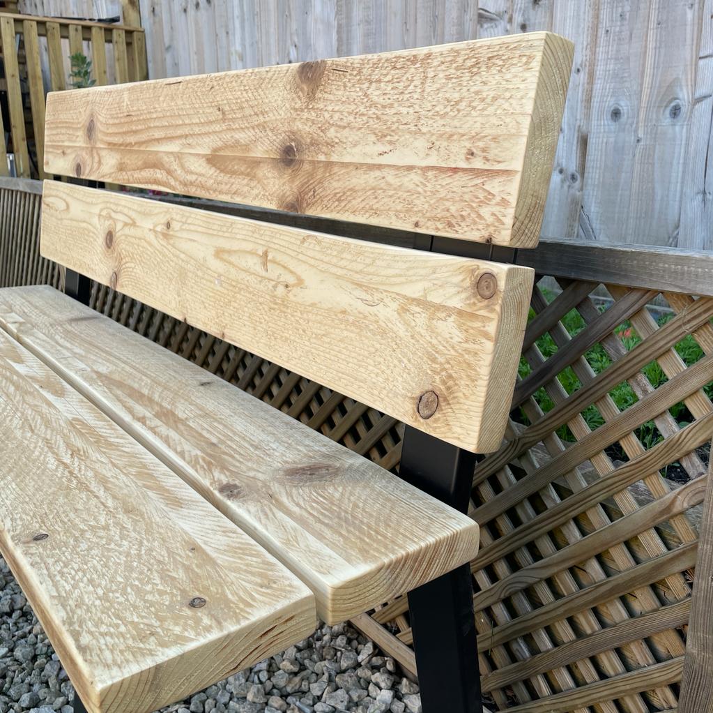 Outside wooden bench with black metal legs