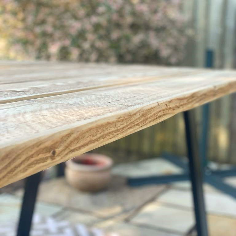 Goegeous grain on an outdoors reclaimed table made from old scaffold boards