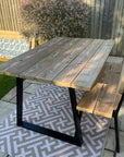 re used timber boards to make a table and chair set for the garden