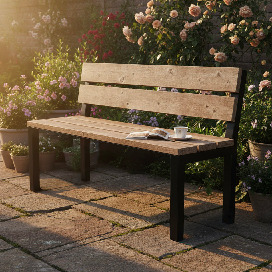 Outdoor Wooden bench on a patio with flowers in the background