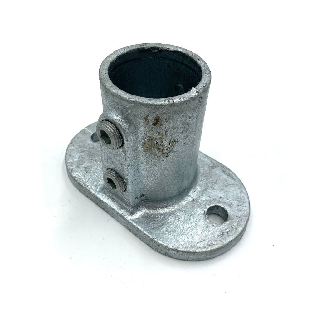 Vertical foot socket for steel rail attaching to hard standing