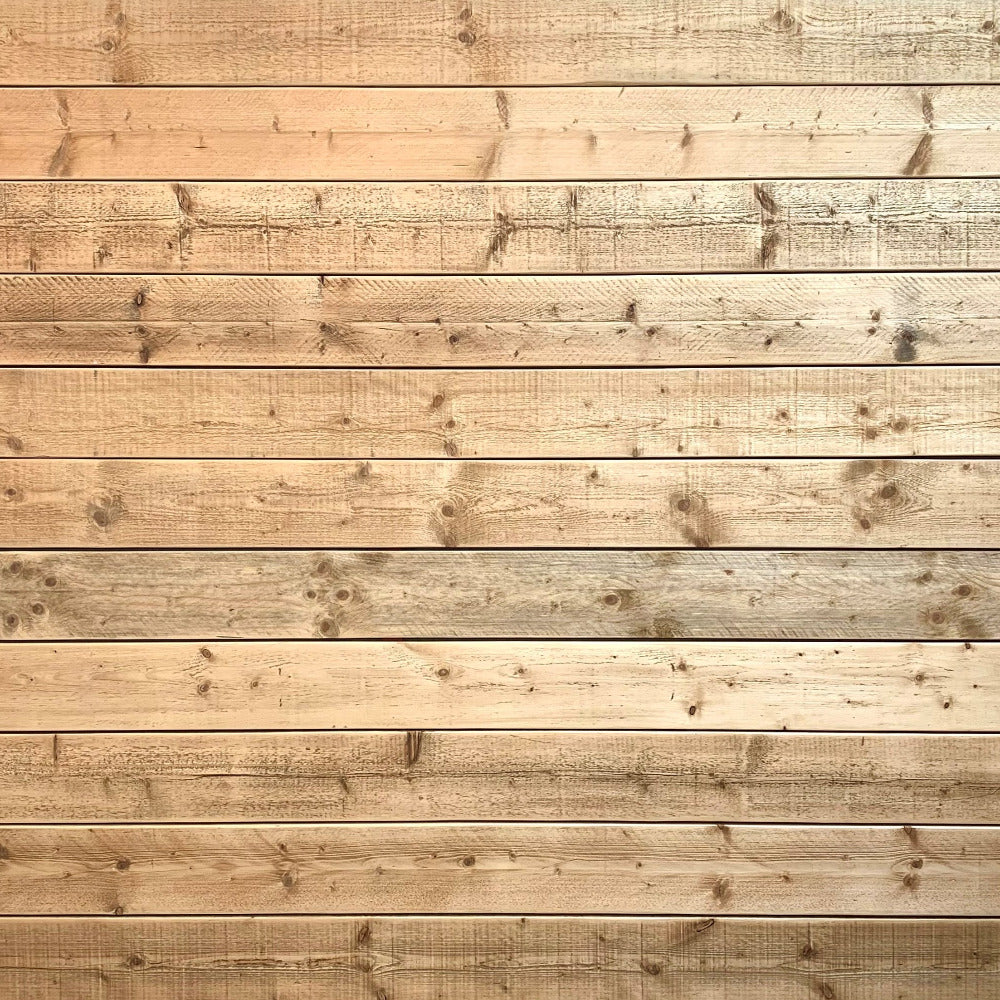 Sanded and oiled scaffold board nailed to wall for cladding