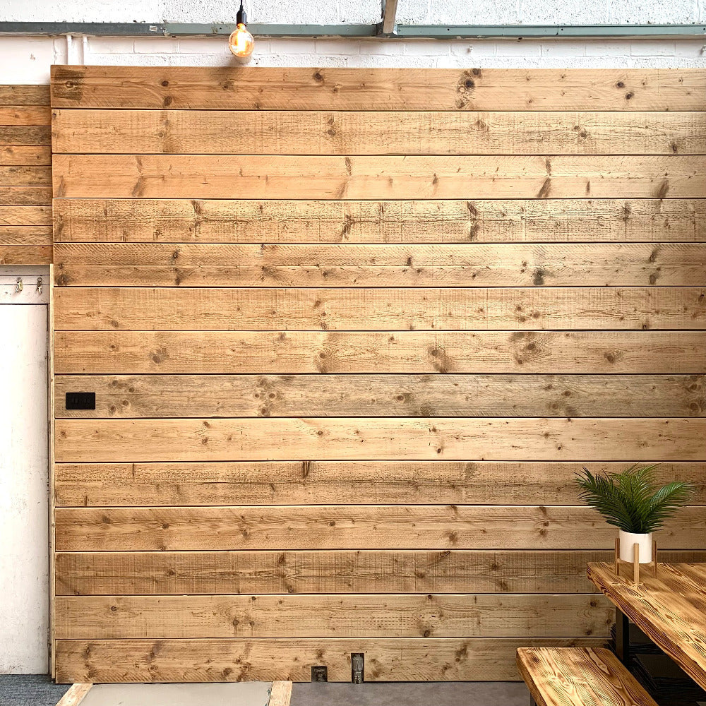 Scaffold boards in The Scaff Shop showroom, made in to a whole wall