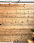 The Scaff Shop showroom wall made from sanded oiled new boards