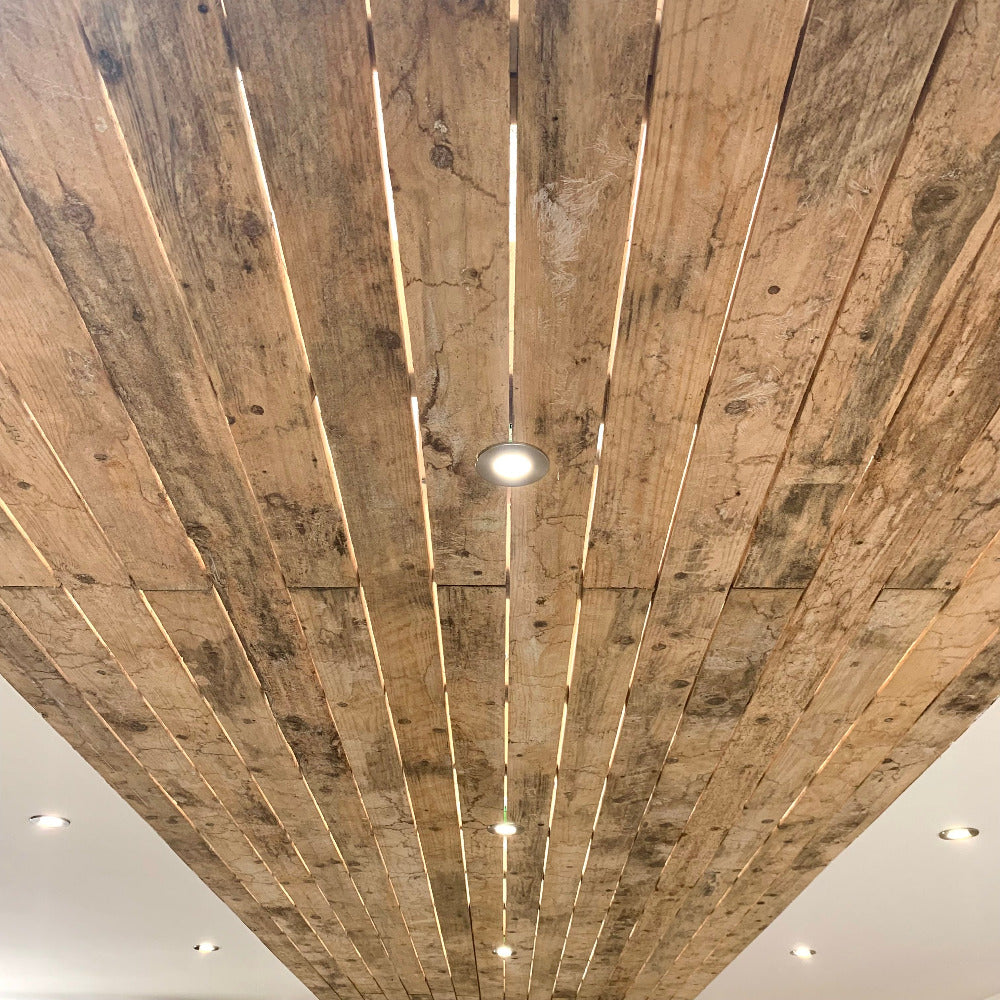 Pallet wood cladding used on ceiling of showroom