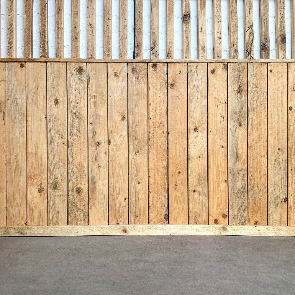 Pallet wood used on lower half of wall for vertical internal cladding